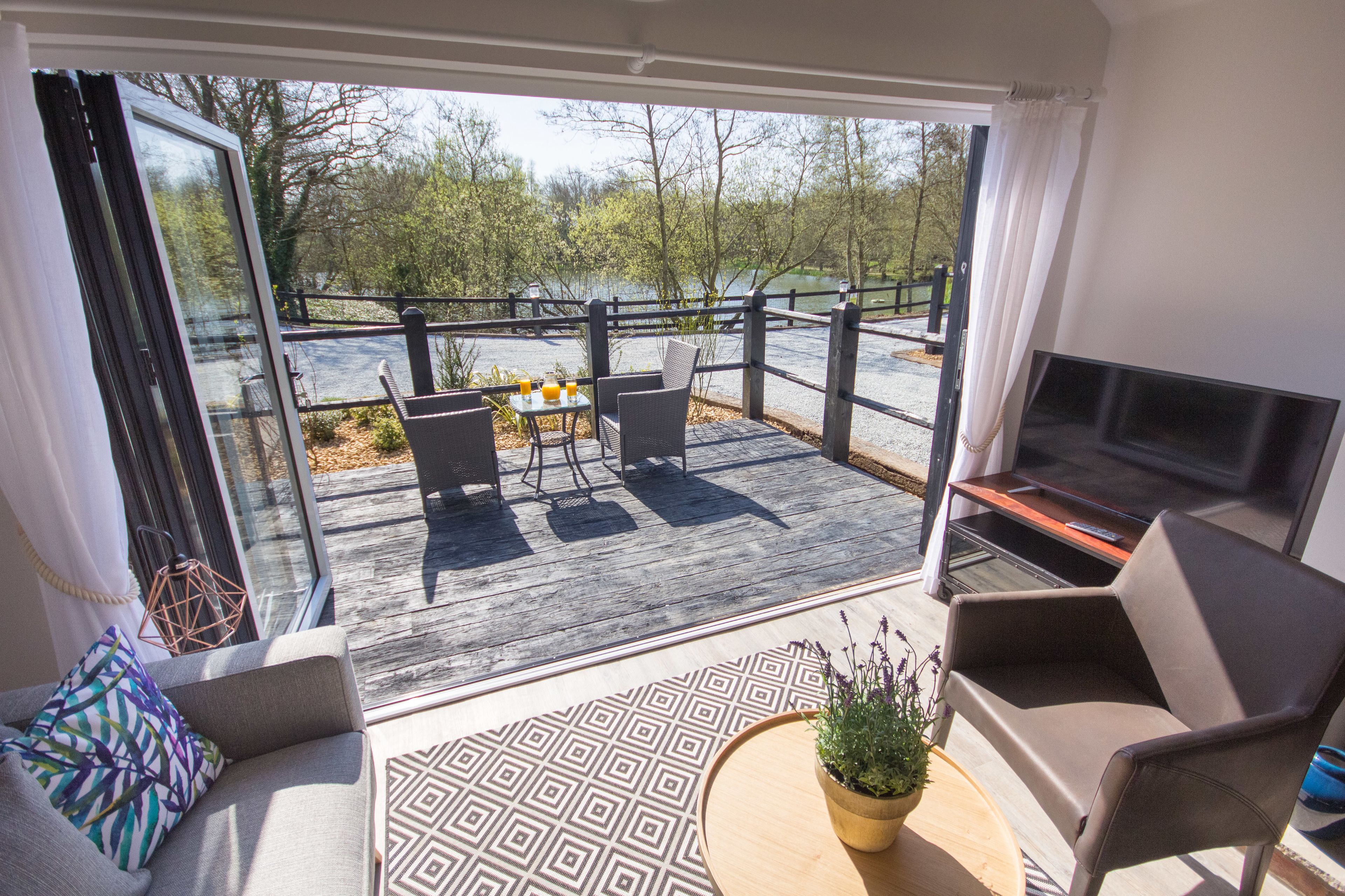 exclusive lakehouse | living area | flat-screen tv