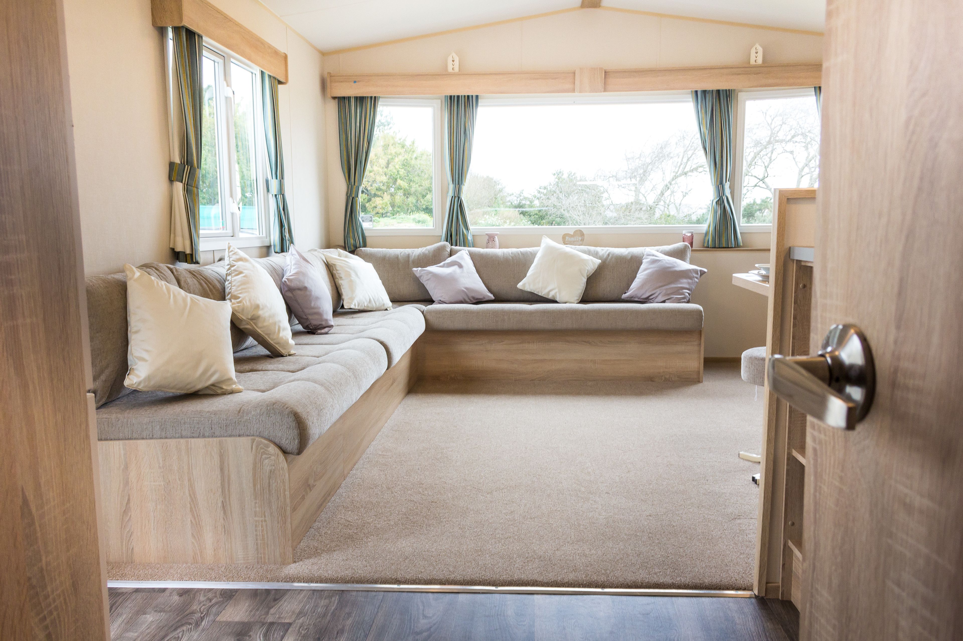 6 berth comfort caravan 3 bed | living area | flat-screen tv