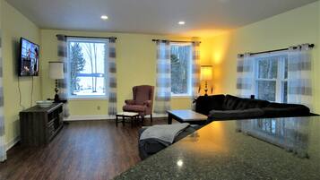 Deluxe Cabin, Multiple Beds, Non Smoking (Turo Home) | Living area | Flat-screen TV