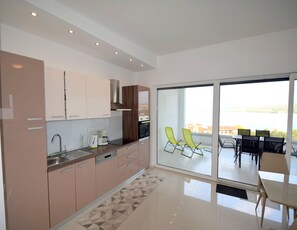 Apartment, 2 Bedrooms (688) | Private kitchen | Fridge, oven, stovetop, dishwasher