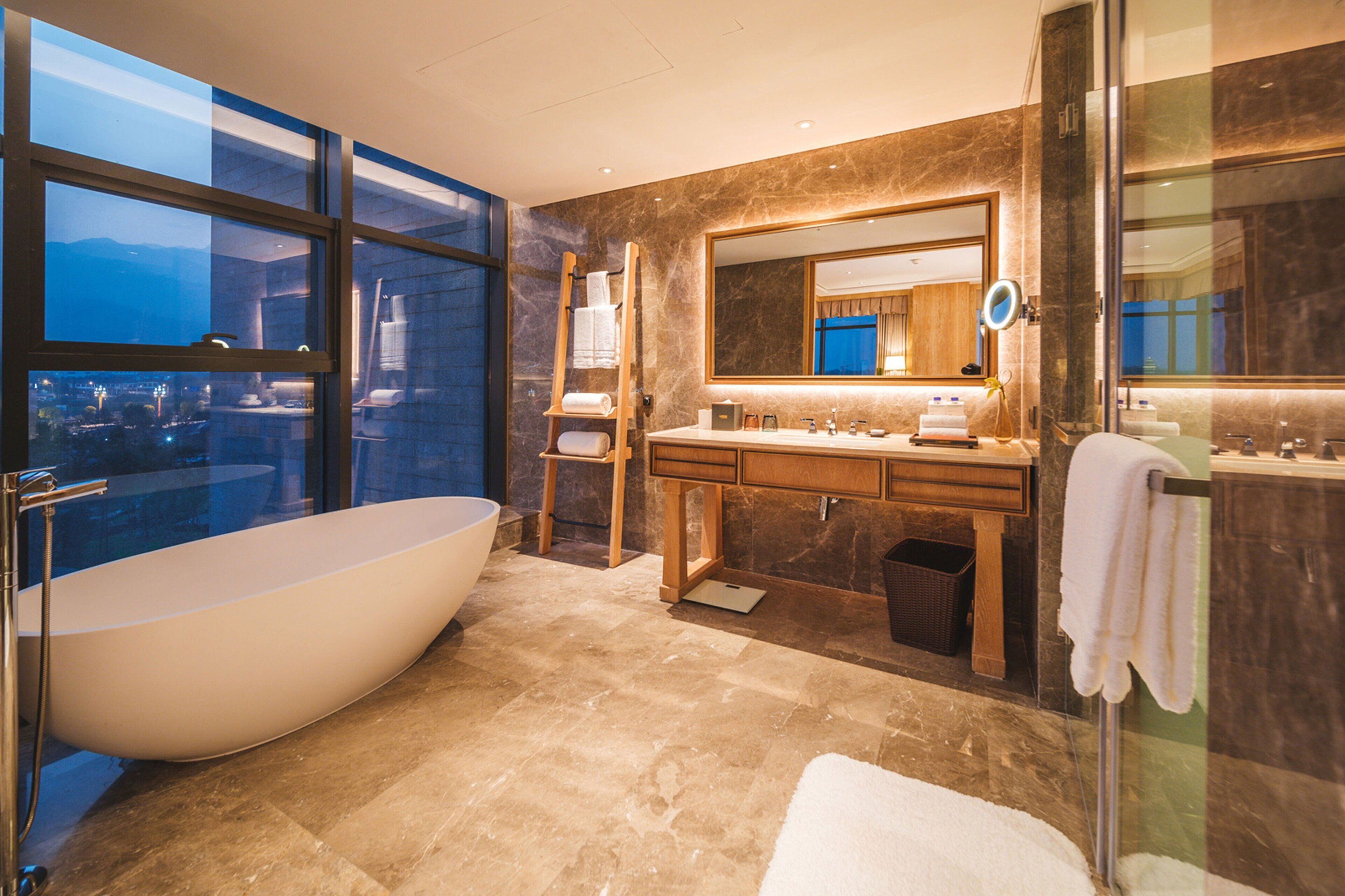 deluxe suite, 1 king bed (deluxe suite) | bathroom | separate bathtub and shower, free toiletries, hair dryer, bathrobes