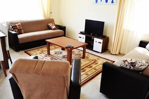 Apartment, 3 Bedrooms | Living room | LCD TV