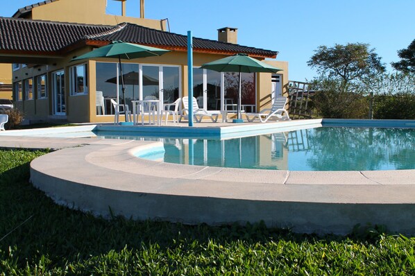 Seasonal outdoor pool, pool umbrellas, pool loungers