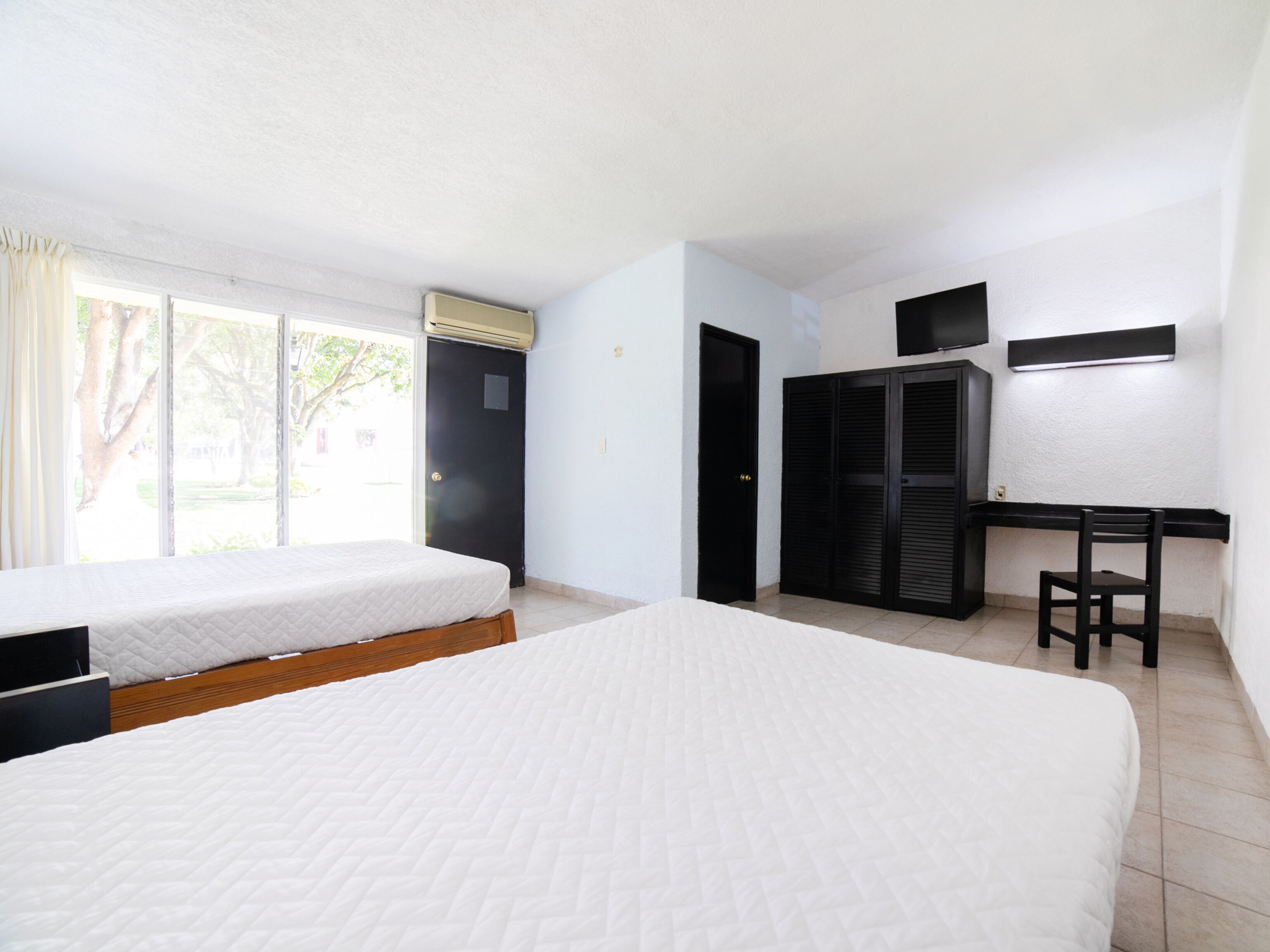 standard room, 2 queen beds | desk, iron/ironing board, bed sheets