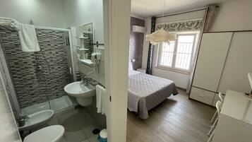 Deluxe Double or Twin Room (#3) | Bathroom | Shower, rainfall showerhead, hair dryer, bidet