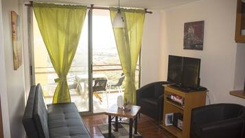 Classic Apartment, Multiple Beds, Smoking, Sea View | Living area | LCD TV