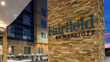A Marriott Fairfield hotel with a stone facade and multiple windows.