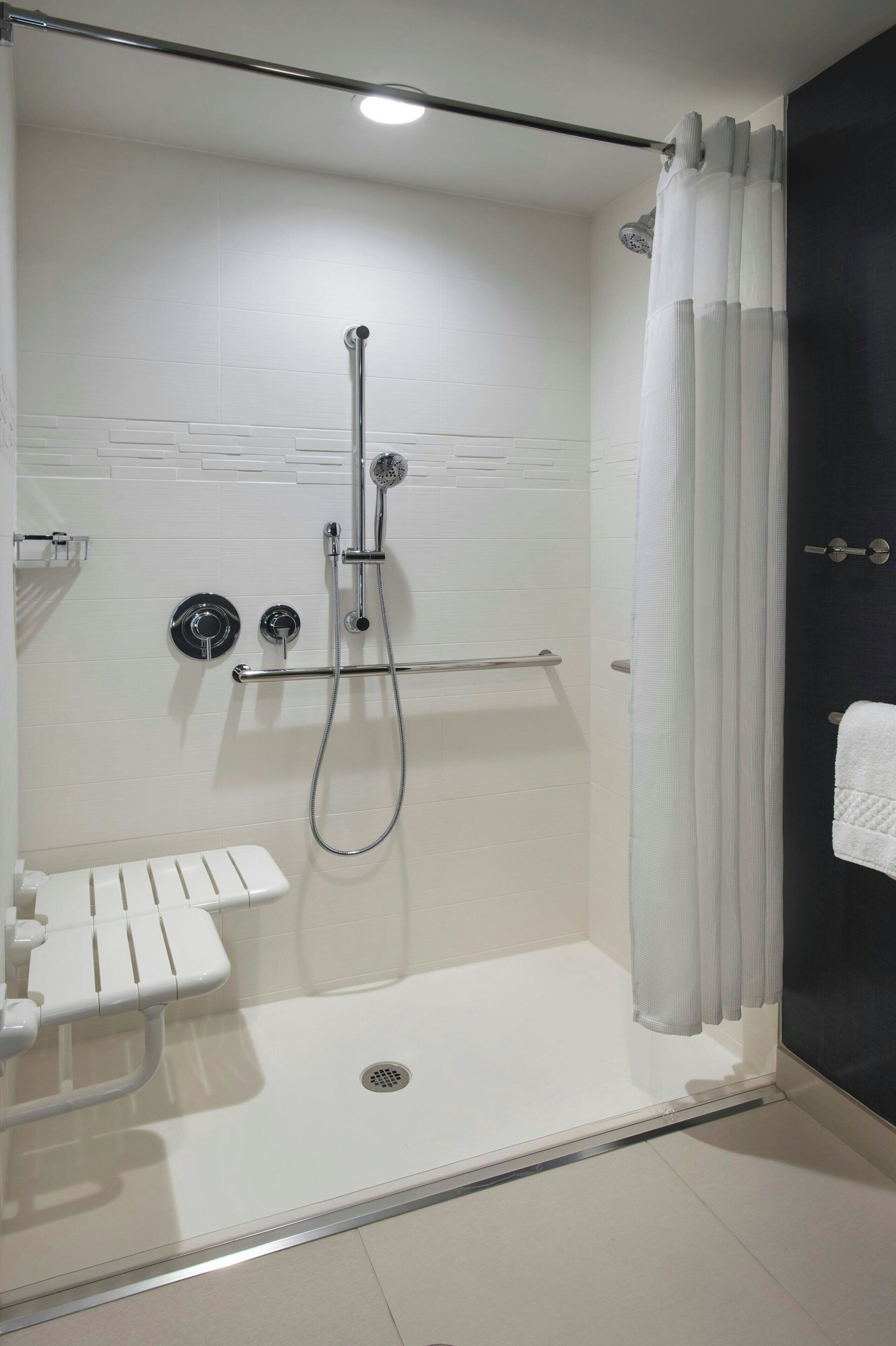 designer toiletries, hair dryer, towels, soap