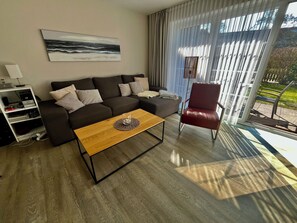 Flat-screen TV, toys, books, stereo