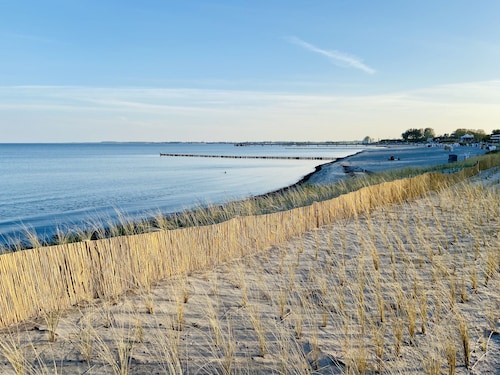 100 m de la plage Sauna | Cheminée | Jacuzzi | WLAN | Blanchisserie | chaise de plage