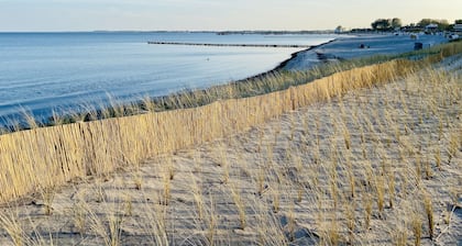 100 m de la plage Sauna | Cheminée | Jacuzzi | WLAN | Blanchisserie | chaise de plage