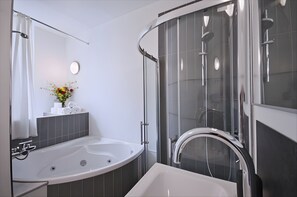 Combined shower/tub, hair dryer, towels, soap