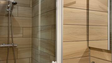 Shower, hair dryer, towels, toilet paper