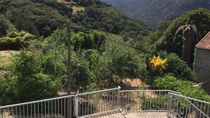 A pool area with a view of a mountainous landscape.