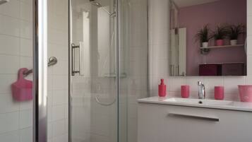 Bathtub, hair dryer, toilet paper