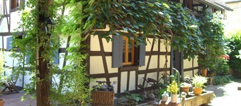 The hospitality of the nice witch in her half-timberings and her calm garden