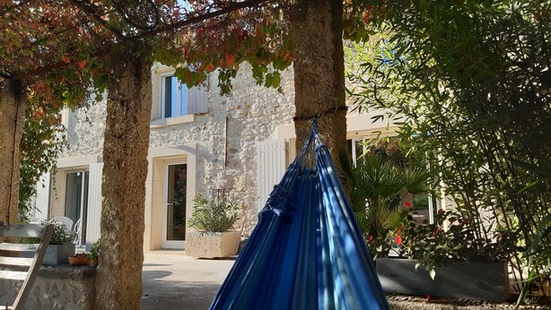 A stone building with a hammock hanging between trees. - VERY NICE HOUSE WITH LUBERON POOL (Cavaillon)