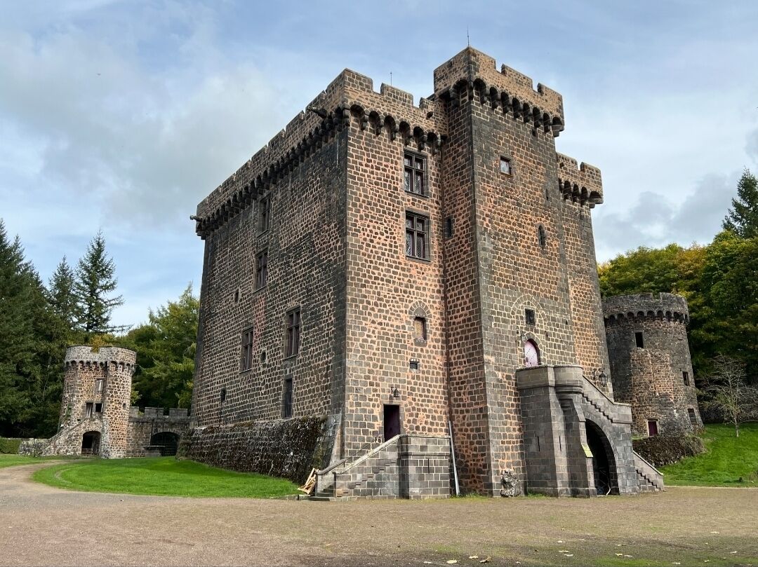 A large stone castle with multiple towers and a central courtyard.