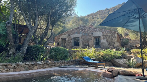 A stone house with a pool, surrounded by trees and rocks. - Quiet sheepfold near Palombaggia beach with private pool. (Porto-Vecchio)