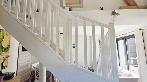 A staircase with white railings leading to an upper level. - Charming new house with garden to the South of Wimereux and close to t (Wimereux)