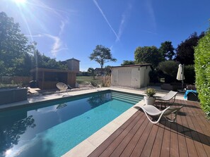 A clear blue pool with wooden deck and lounge chairs. - Stone house for 6 people, heated pool, bowling green, summer kitchen  (Bertric-Burée)