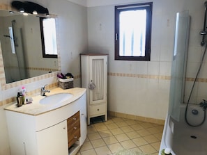Shower, hair dryer, towels, soap