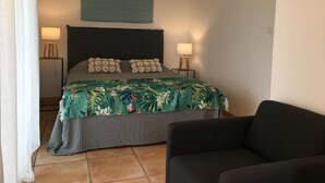 A bedroom with a bed, two bedside lamps, a ceiling fan, a dark headboard, and a floral bedspread. - PROMOTION summer: from 13/07 to 20/07 and 17/08 to 24/08 945 euros instead of 1500 eur (Verzeille)