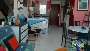 A room with a bed, a desk, a chair, a table, and a window. - Newly built house, all mod cons (La Turballe)