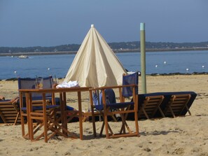 On the beach, sun-loungers