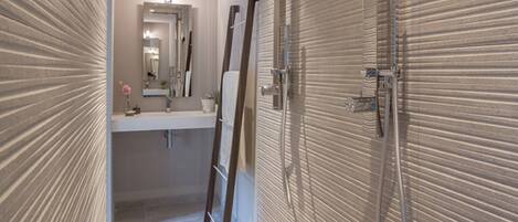 Shower, hair dryer, towels, toilet paper