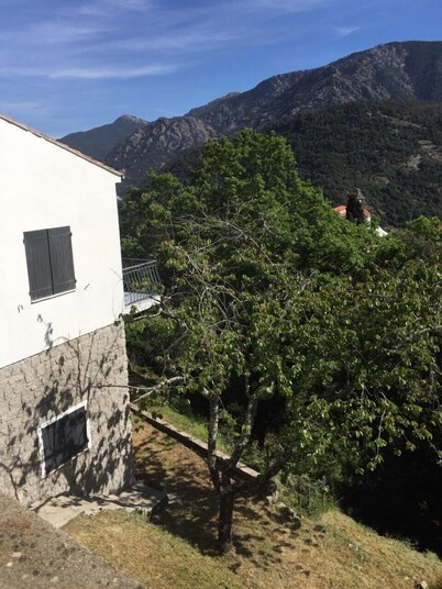 House between sea and mountains