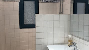 Shower, towels, soap, toilet paper