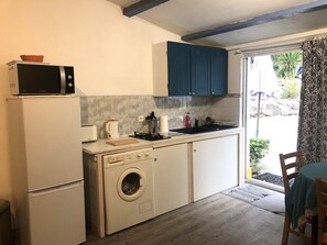 Fridge, microwave, stovetop, coffee/tea maker