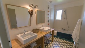 A bathroom with two sinks, a mirror, a shower, and patterned floor tiles. - Villa 6 pers / with heated pool / near golf & beach / Holiday home (Moliets-Et-Maa)