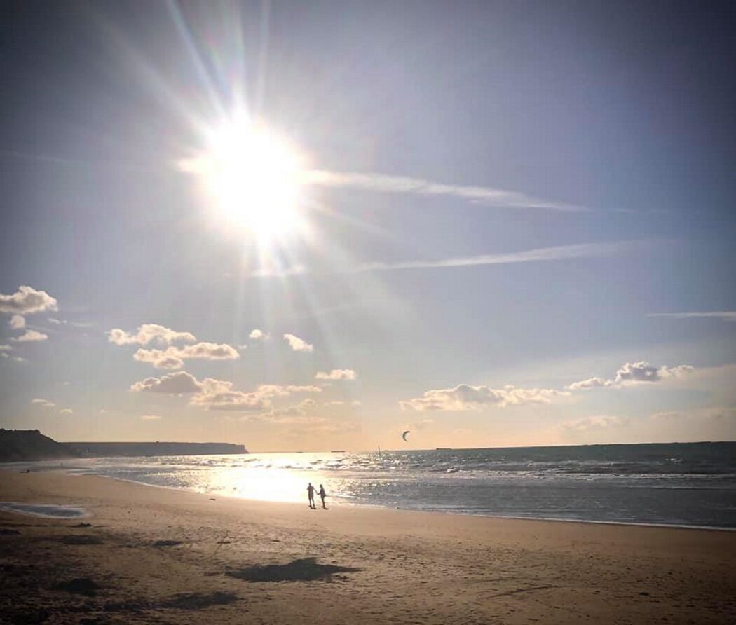 On the beach, sun-loungers