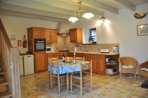 Enjoy cooking in this well-equipped kitchen with a dining area.