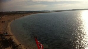 A beach with a sandy shore and calm water. - Provencal Mas absolute quietness, nice facilities (La Farlède)