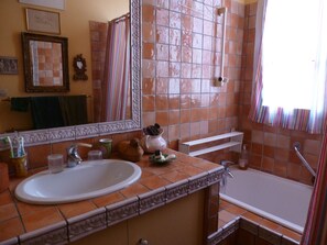 Combined shower/tub, hair dryer, towels, toilet paper