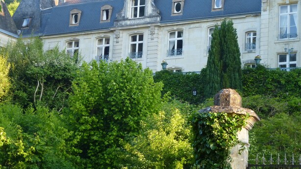 A large, historic building with multiple windows and a prominent central tower. - Château de la Voûte, facing south (Troo)