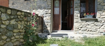 Stone house with terrace in typical mountain village on GR 54