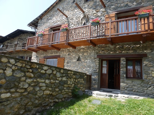 Stone house with terrace in typical mountain village on GR 54