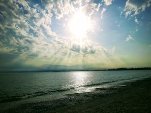 On the beach, sun-loungers