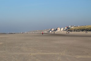 On the beach, sun-loungers