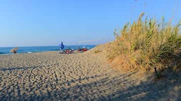 On the beach, sun-loungers, beach umbrellas
