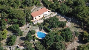 An aerial view of a property with a house, a swimming pool, and a second pool. - Small villa located in a quiet pool and sea view / Gulf of Policastro (MARATEA)