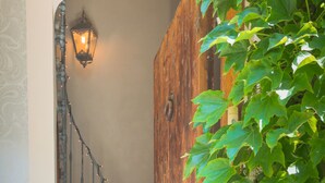 A wooden staircase with a lantern and potted plants. - OLD BUILDING Pool, Garden and Terrace views towards GORDES and JOUCAS (Goult)