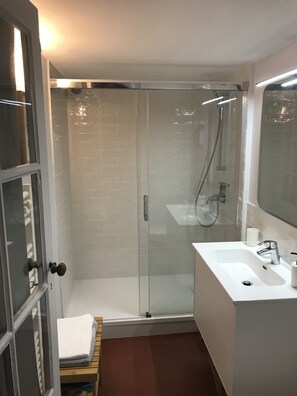 Shower, hair dryer, towels, soap