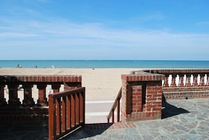 On the beach, sun-loungers