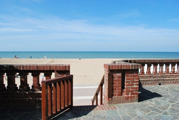 On the beach, sun-loungers