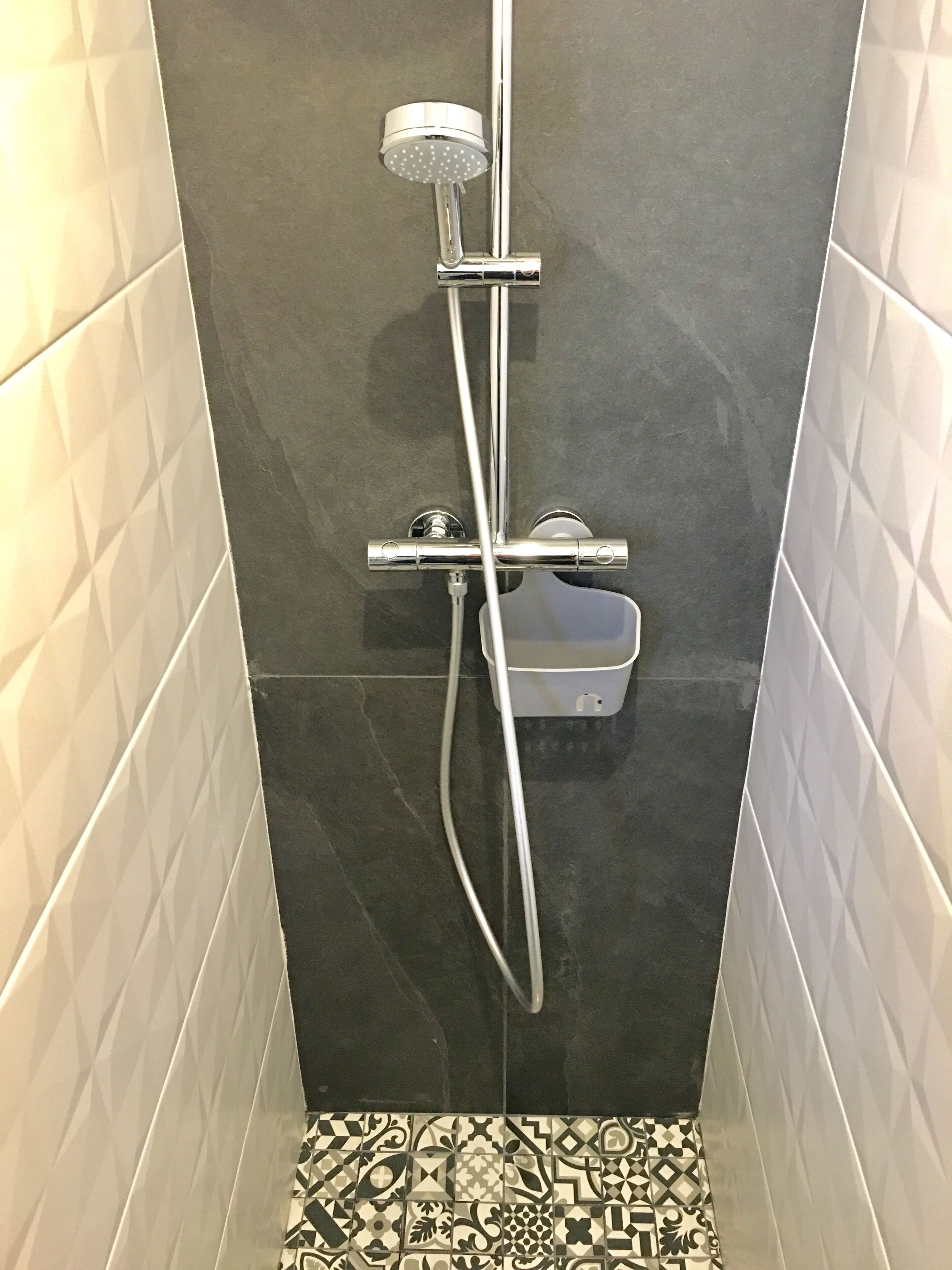 Bathtub, hair dryer, towels, toilet paper